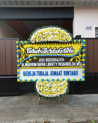 Papan Bunga Duka di Toloa